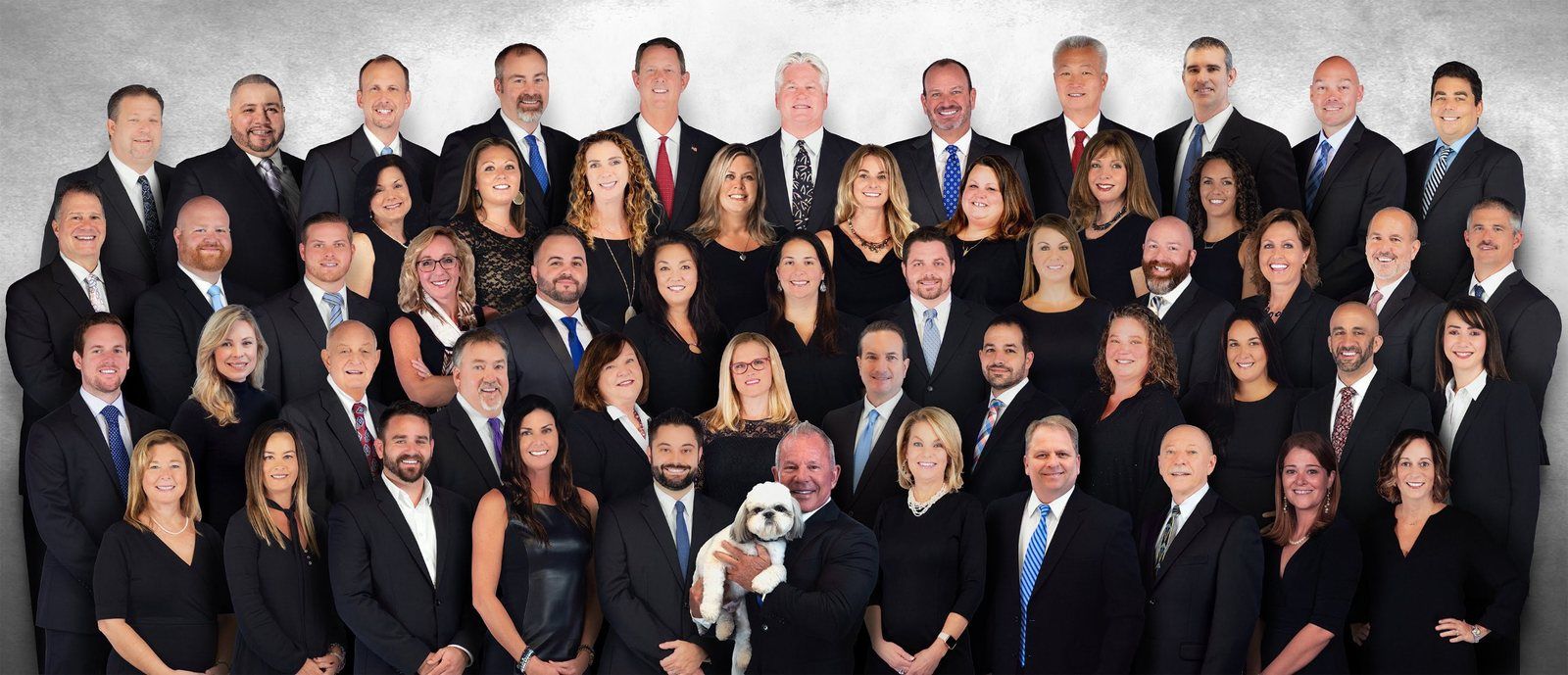 Virtual team photo: 55 individually shot portraits composited into one group shot, so new hires are added and departures removed without reshooting the company